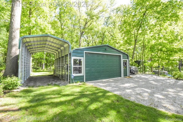 841 Hurley Dr, Howell, MI 48843 - detached garage featuring a detached carport and driveway