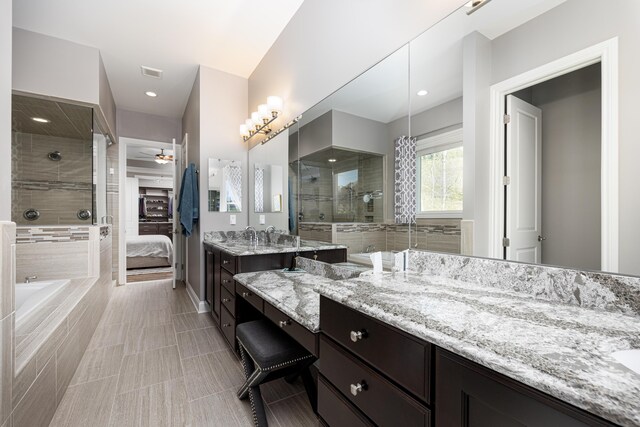 ensuite bathroom featuring ensuite bath, ceiling fan, a tile shower, tile patterned floors, and vanity