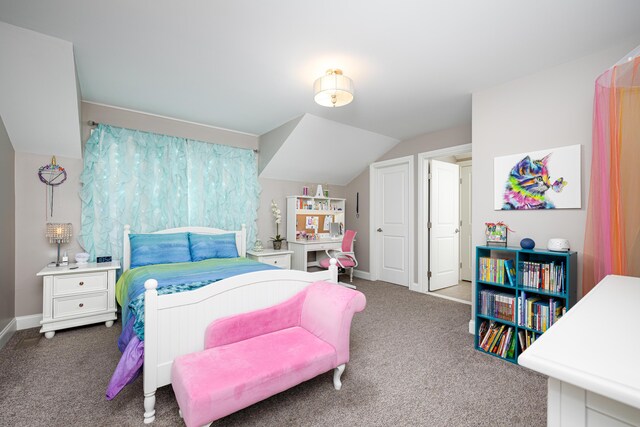 bedroom featuring baseboards, carpet floors, and vaulted ceiling