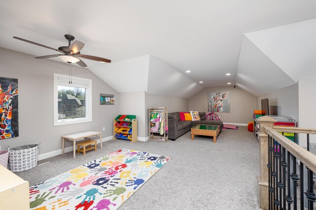 rec room with vaulted ceiling, ceiling fan, carpet flooring, and baseboards