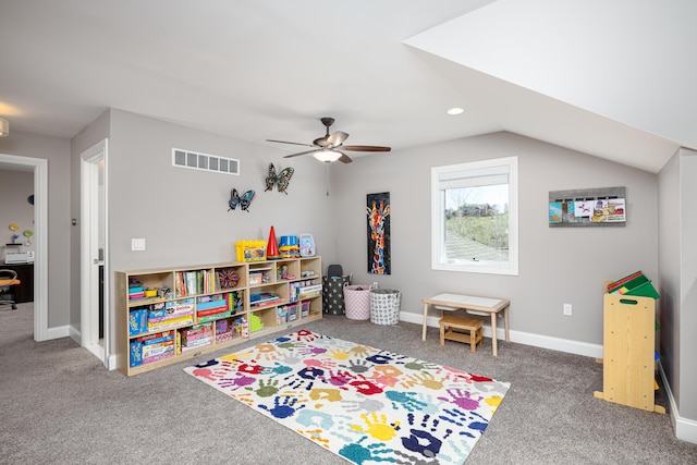 rec room featuring a ceiling fan, lofted ceiling, carpet, baseboards, and visible vents