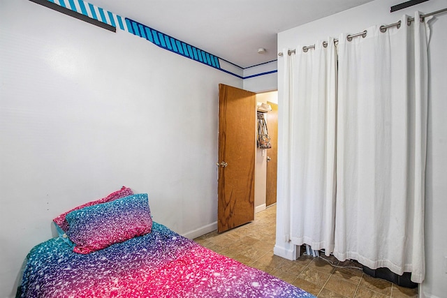 bedroom with baseboards