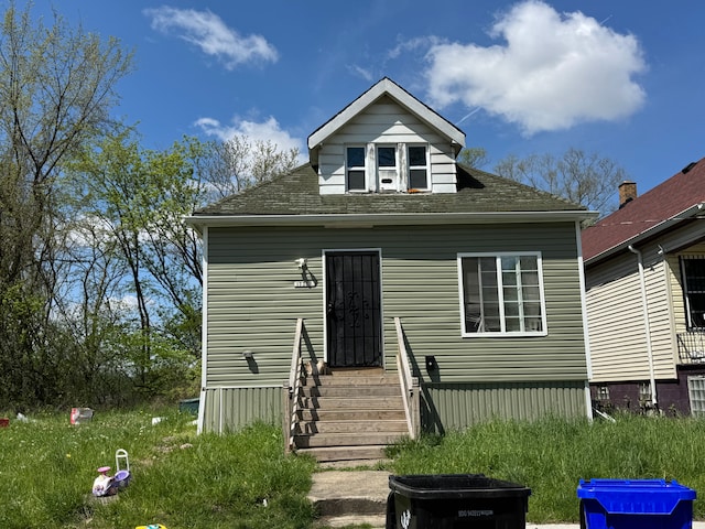17333 Fenelon St, Hamtramck, MI 48212 - rear view of house featuring entry steps and a shingled roof