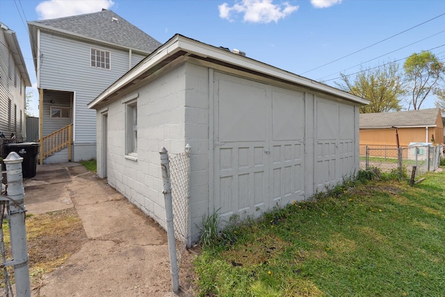 view of outdoor structure with an outbuilding and fence