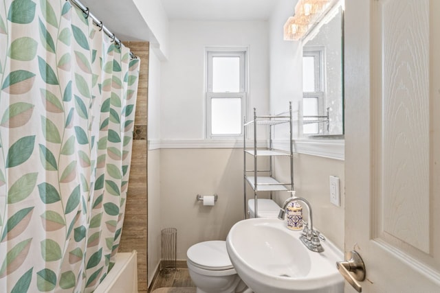 5125 Curtis St, Dearborn, MI 48126 - bathroom with a sink, toilet, baseboards, and shower / bath combo with shower curtain