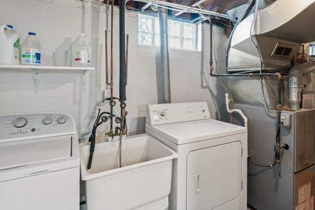 5125 Curtis St, Dearborn, MI 48126 - laundry area with concrete block wall, independent washer and dryer, and heating unit
