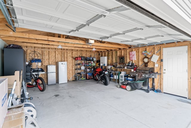 5125 Curtis St, Dearborn, MI 48126 - garage with freestanding refrigerator, a garage door opener, and wood walls