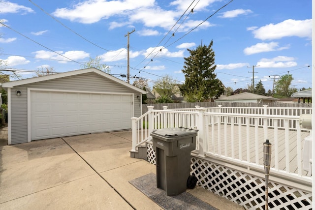 5125 Curtis St, Dearborn, MI 48126 - view of patio with an outdoor structure, a garage, and fence