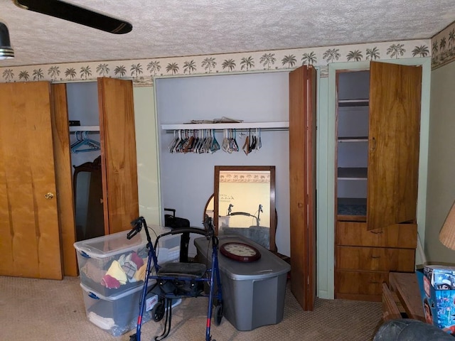 bedroom with carpet and a textured ceiling