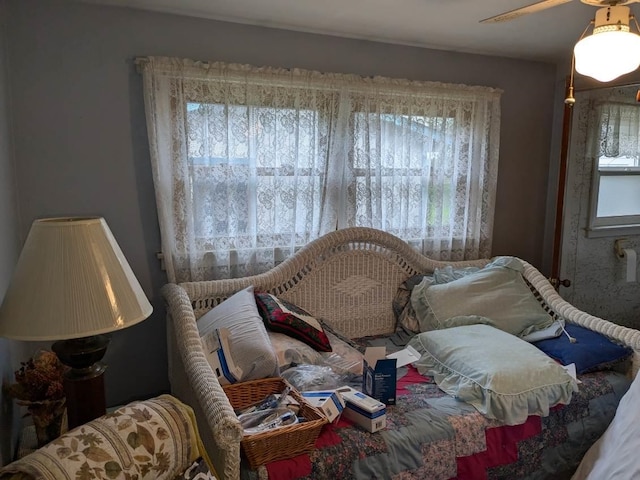 bedroom with multiple windows and a ceiling fan