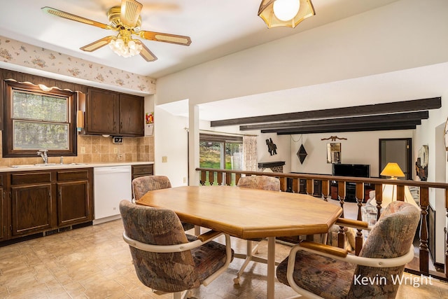 dining area with ceiling fan and beamed ceiling