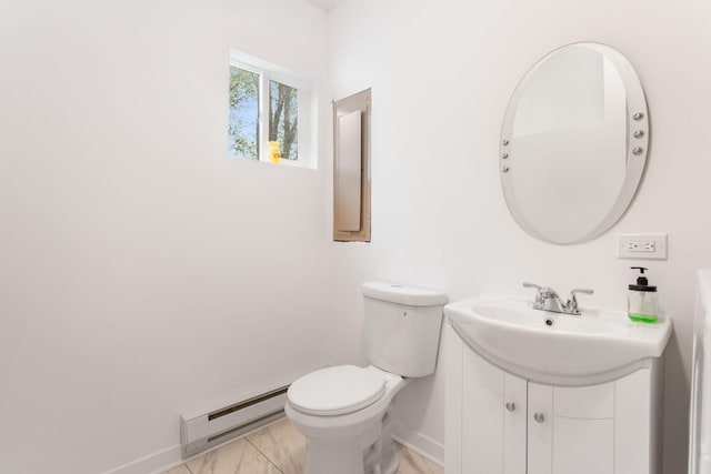 bathroom with vanity, toilet, baseboards, and baseboard heating