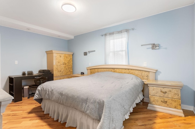 bedroom featuring light wood finished floors