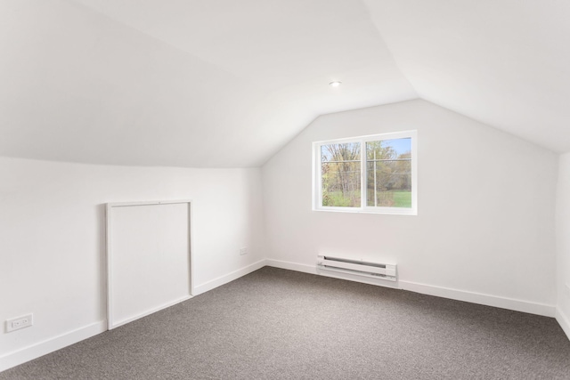 bonus room with lofted ceiling, baseboards, baseboard heating, and dark carpet