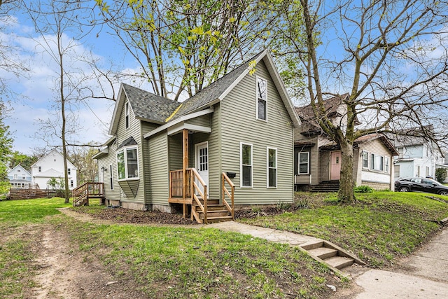 view of front of home featuring roof with shingles