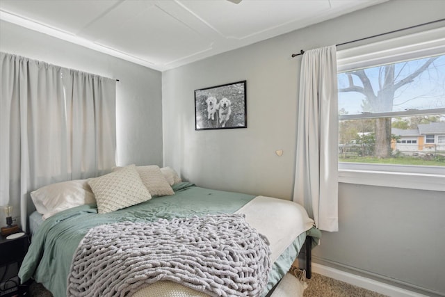 carpeted bedroom with baseboards