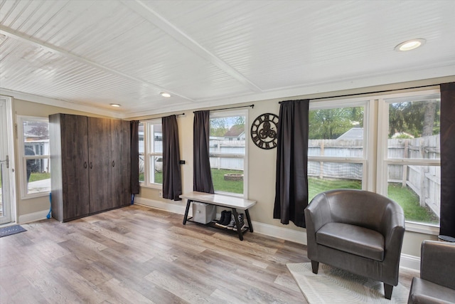 sitting room with baseboards, light wood-style floors, and recessed lighting