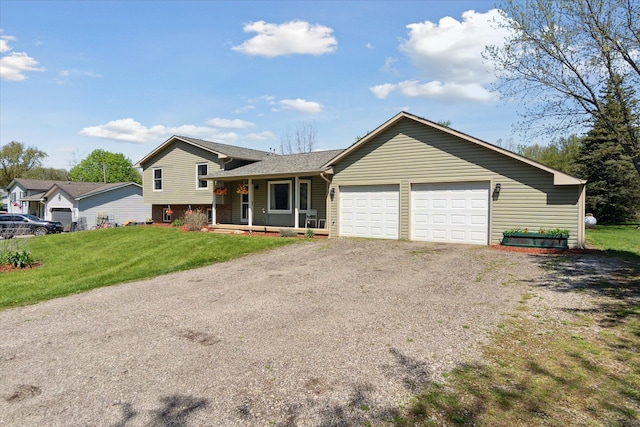 12441 Ray Rd, Ortonville, MI 48462 - tri-level home with gravel driveway, a porch, an attached garage, and a front yard