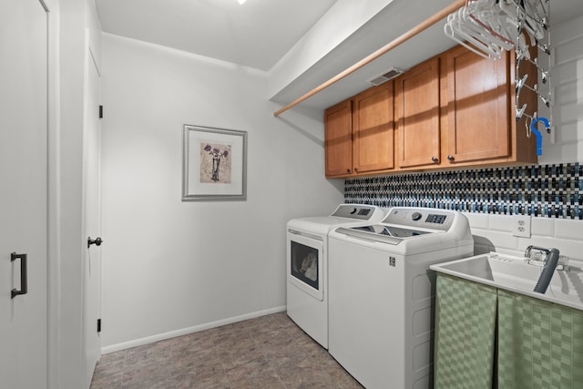 4943 Canyon Oaks Dr, Brighton, MI 48114 - washroom with washer and dryer, cabinet space, and baseboards