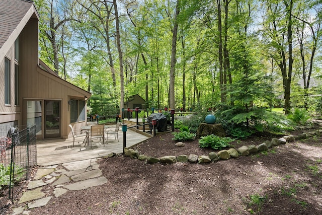 4943 Canyon Oaks Dr, Brighton, MI 48114 - view of yard featuring outdoor dining space and a wooden deck