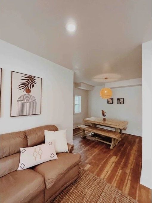 living room with recessed lighting and wood finished floors