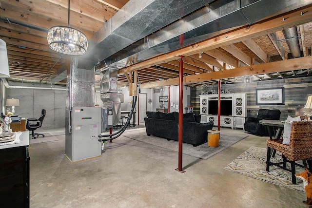 unfinished basement featuring heating unit