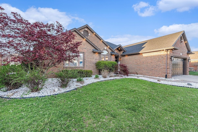16511 Trailway Dr, Macomb, MI 48042 - view of front of house with brick siding, a garage, a front yard, a shingled roof, and driveway