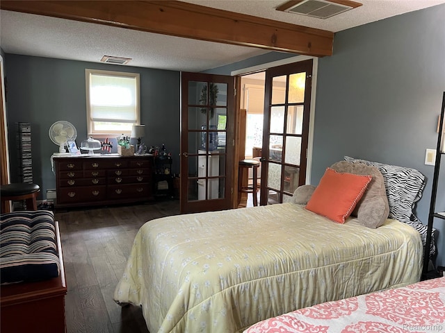 4564 Wildwood Rd, Alger, MI 48610 - bedroom featuring hardwood / wood-style floors, french doors, and a textured ceiling