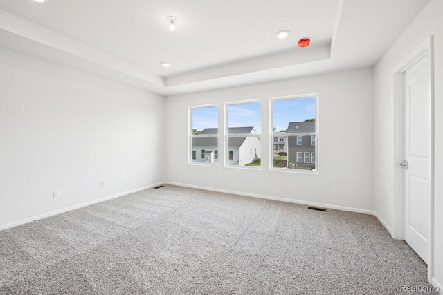 27142 Silo Dr, Saline, MI 48176 - carpeted empty room featuring a raised ceiling and recessed lighting