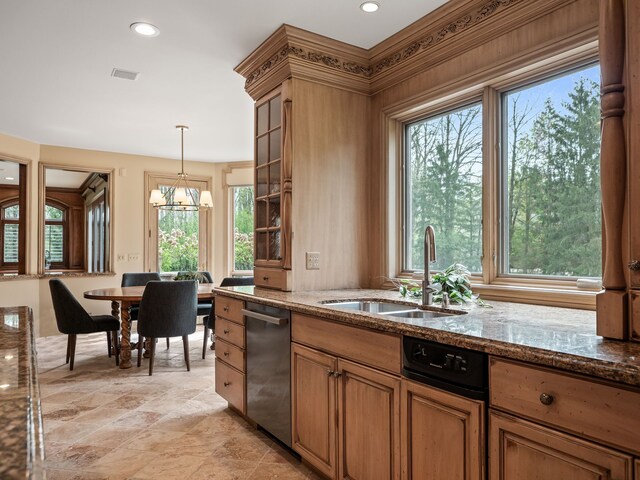 23755 Woodlynne Dr, Bingham Farms, MI 48025 - kitchen featuring a sink, dishwasher, dark stone countertops, brown cabinetry, and hanging light fixtures