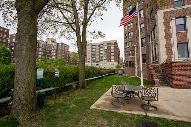 8162 E Jefferson Ave Unit 16A, Detroit, MI 48214 - view of property's community with a patio and a yard