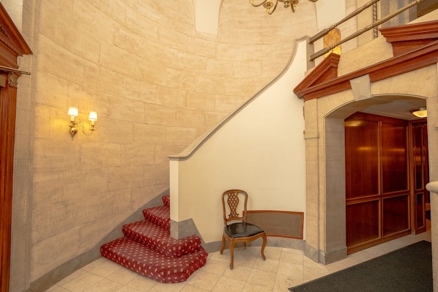 8162 E Jefferson Ave Unit 16A, Detroit, MI 48214 - stairs featuring arched walkways and baseboards