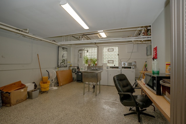 8162 E Jefferson Ave Unit 16A, Detroit, MI 48214 - office area featuring independent washer and dryer, speckle patterned floor, and a sink