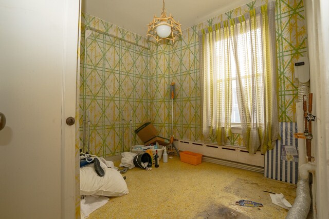 8162 E Jefferson Ave Unit 16A, Detroit, MI 48214 - bathroom featuring baseboard heating and plenty of natural light
