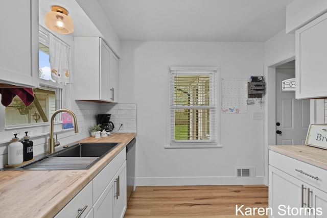 kitchen with a sink, plenty of natural light, and dishwasher