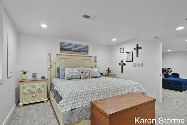 bedroom with light carpet, visible vents, and recessed lighting