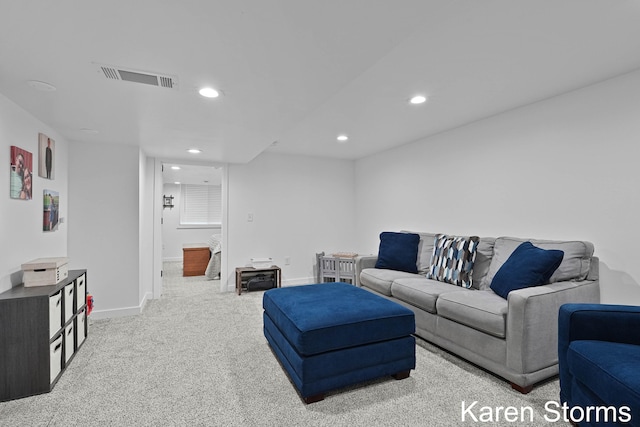 carpeted living room with baseboards, visible vents, and recessed lighting