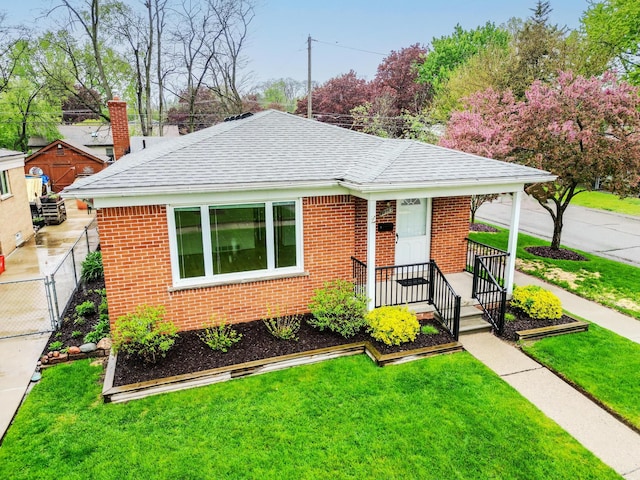 18377 Sunset St, Livonia, MI 48152 - bungalow featuring roof with shingles and brick siding