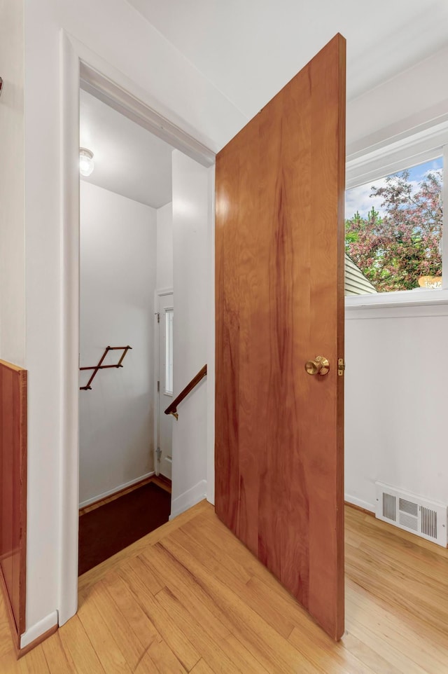 18377 Sunset St, Livonia, MI 48152 - stairs featuring wood finished floors and baseboards