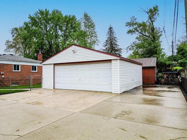 18377 Sunset St, Livonia, MI 48152 - detached garage featuring fence
