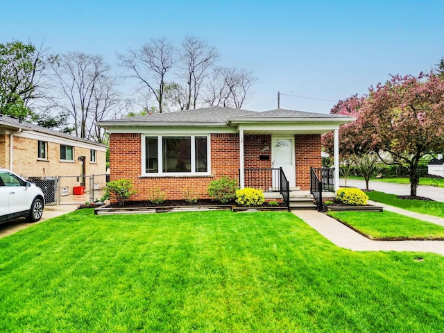 18377 Sunset St, Livonia, MI 48152 - view of front facade with brick siding and a shingled roof