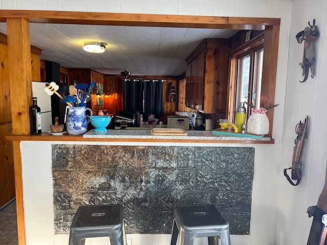 kitchen with wood walls