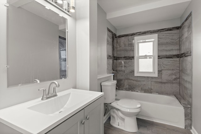 bathroom with shower / bath combination, vanity, toilet, and wood finished floors