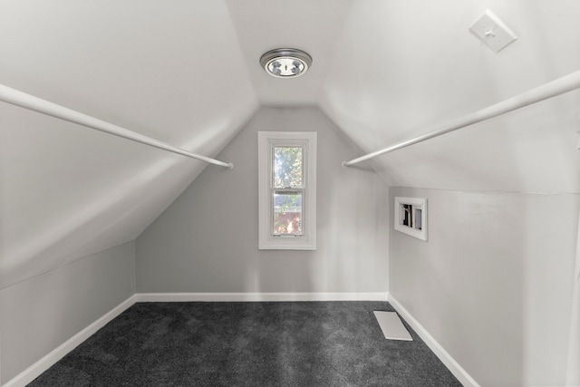 bonus room featuring lofted ceiling, baseboards, and carpet floors