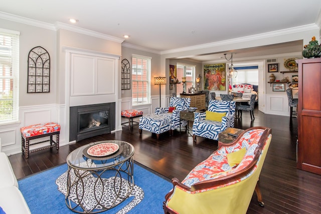 438 Filmore St, Canton, MI 48188 - living room featuring crown molding, a wealth of natural light, dark wood-style flooring, and a wainscoted wall