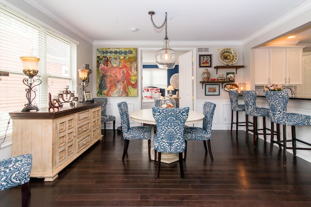 438 Filmore St, Canton, MI 48188 - dining space featuring a wainscoted wall, a decorative wall, crown molding, and dark wood-style floors