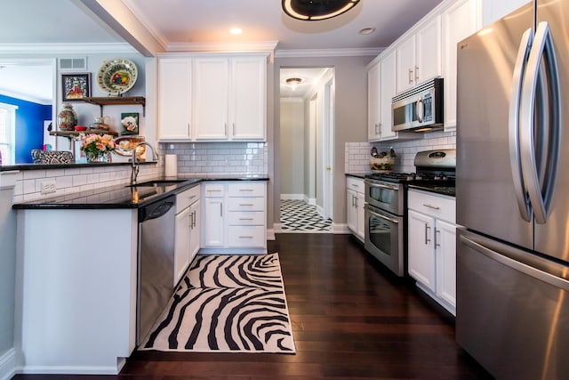 438 Filmore St, Canton, MI 48188 - kitchen with a sink, crown molding, white cabinetry, and appliances with stainless steel finishes