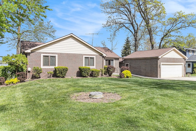 8570 Riverside Dr, Brighton, MI 48116 - view of front of property featuring brick siding, a garage, and a front yard