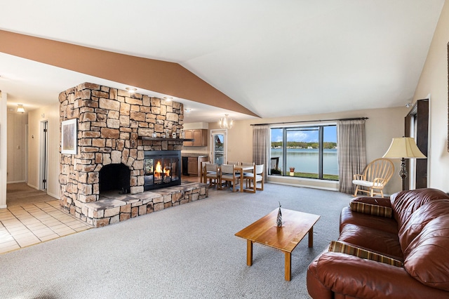 8570 Riverside Dr, Brighton, MI 48116 - living room featuring light colored carpet, lofted ceiling, a fireplace, and a water view