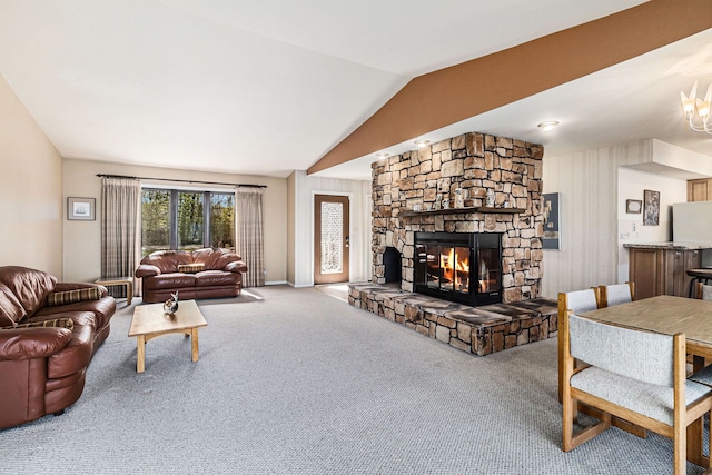 8570 Riverside Dr, Brighton, MI 48116 - carpeted living room featuring vaulted ceiling, a fireplace, and baseboards